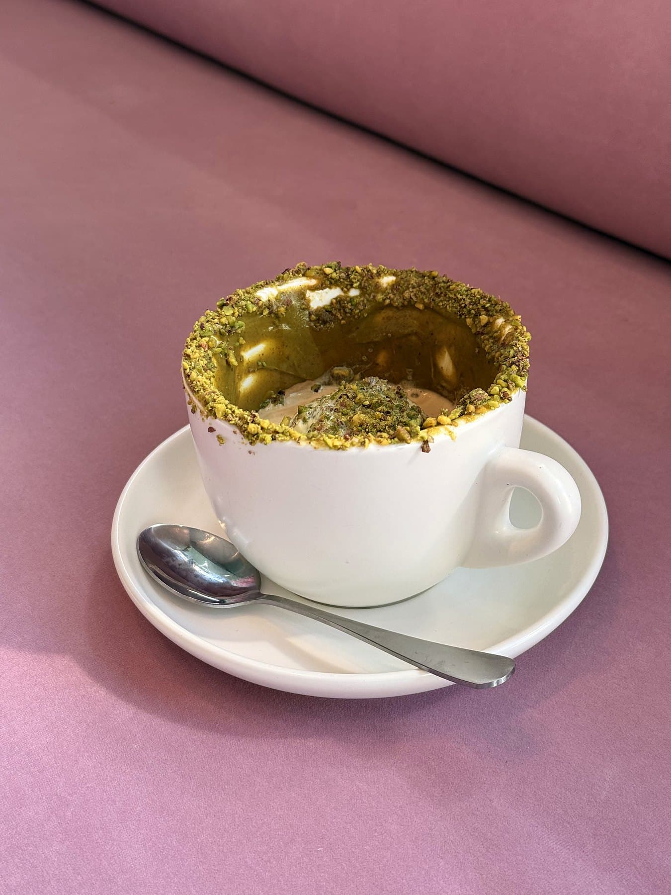 Pistachio affogato with a crushed pistachio rim